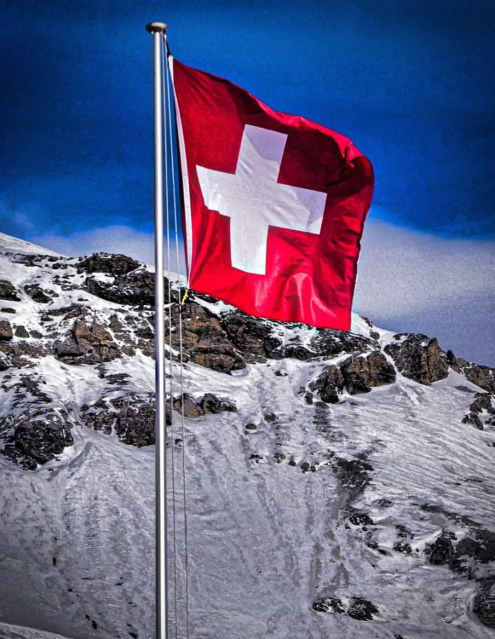 The Swiss flag on the mountain